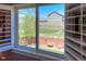 Window view showcasing the backyard, including a well-maintained lawn and a neighboring house at 14533 W 69Th Pl, Arvada, CO 80004