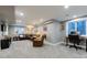 Finished basement with a TV, furniture, a window and an office work space at 14533 W 69Th Pl, Arvada, CO 80004