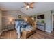 Comfortable main bedroom with vaulted ceilings, and hardwood floors with ensuite bathroom at 14533 W 69Th Pl, Arvada, CO 80004