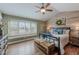 Comfortable main bedroom with vaulted ceilings, shuttered windows and hardwood floors at 14533 W 69Th Pl, Arvada, CO 80004