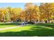 Beautiful park with walking trails, trees, and a playground, ideal for outdoor activities and recreation at 14533 W 69Th Pl, Arvada, CO 80004