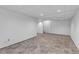Large finished basement with neutral walls, carpeted flooring, and recessed lighting at 1606 Iris St, Broomfield, CO 80020