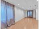 Spacious finished basement with neutral walls, hardwood flooring, and recessed lighting at 1606 Iris St, Broomfield, CO 80020