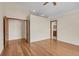 Bedroom features hardwood floors, closet and ensuite bathroom at 1606 Iris St, Broomfield, CO 80020