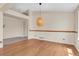 Open dining room area featuring hardwood floors and neutral colored walls at 1606 Iris St, Broomfield, CO 80020
