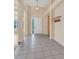 Welcoming foyer with neutral colors, tile flooring, and high ceilings at 1606 Iris St, Broomfield, CO 80020