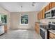 Functional kitchen with stainless steel appliances and tile flooring at 1606 Iris St, Broomfield, CO 80020