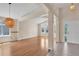 Bright living area with hardwood floors, exposed beam architecture, and large windows at 1606 Iris St, Broomfield, CO 80020