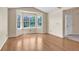 Bright living space featuring hardwood floors, bay windows and neutral paint at 1606 Iris St, Broomfield, CO 80020