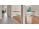 Open-concept floor plan featuring living room with hardwood floors and natural light at 1606 Iris St, Broomfield, CO 80020