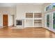 Cozy living room features fireplace and built-in shelves, bathed in natural light at 1606 Iris St, Broomfield, CO 80020