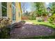 A brick paved patio with steps leading to lawn and garden space, perfect for outdoor entertaining at 1606 Iris St, Broomfield, CO 80020