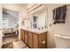 Updated bathroom with double vanity and a large mirror at 23406 E 5Th Pl # 203, Aurora, CO 80018