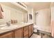 Clean bathroom with double sinks, a bathtub, and shower at 23406 E 5Th Pl # 203, Aurora, CO 80018