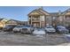 Front view of two story townhome with parking at 23406 E 5Th Pl # 203, Aurora, CO 80018