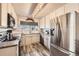 Modern kitchen with stainless steel appliances and ample cabinet space at 23406 E 5Th Pl # 203, Aurora, CO 80018