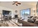 Bright living room features a fireplace, wood floors, and sliding glass doors to a balcony at 23406 E 5Th Pl # 203, Aurora, CO 80018