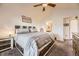 Main bedroom with ensuite bathroom access and a king-size bed at 23406 E 5Th Pl # 203, Aurora, CO 80018