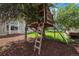 Fun backyard featuring a custom-built treehouse, perfect for of all ages at 5573 S Taft St, Littleton, CO 80127