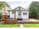 Backyard featuring a wooden deck with a hot tub and string lights at 4421 Raleigh St, Denver, CO 80212
