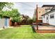 Backyard with spacious lawn and deck at 4421 Raleigh St, Denver, CO 80212