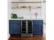 Stylish bar with a built-in wine fridge and wood shelving at 4421 Raleigh St, Denver, CO 80212
