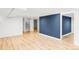 Spacious basement area features hardwood floors and a stairway at 4421 Raleigh St, Denver, CO 80212
