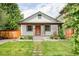Charming single-story home with a well-manicured lawn and inviting front porch at 4421 Raleigh St, Denver, CO 80212