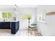 Bright kitchen nook with counter seating, white walls, and tiled floors at 4421 Raleigh St, Denver, CO 80212