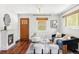 Bright living room with a fireplace, hardwood floors, and stylish furnishings at 4421 Raleigh St, Denver, CO 80212