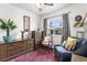 Bright bedroom with stylish decor, featuring unique furniture and a comfortable sitting area at 75 Vrain St, Denver, CO 80219