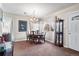 Cozy dining room with elegant chandelier and decorative display cabinet at 75 Vrain St, Denver, CO 80219