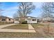 Charming single story home with mature trees and quaint front yard at 75 Vrain St, Denver, CO 80219