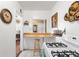 Bright kitchen with breakfast bar and view into the living room at 75 Vrain St, Denver, CO 80219