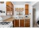 The kitchen features wood cabinets, a stainless steel sink, and a rooster-themed window covering at 75 Vrain St, Denver, CO 80219
