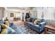 Comfortable living room featuring plush seating, large windows, and an open layout at 75 Vrain St, Denver, CO 80219