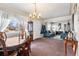 Open concept living and dining room with comfortable furniture at 75 Vrain St, Denver, CO 80219