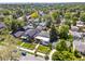 Aerial view of neighborhood homes with mature landscaping and tree coverage at 2025 Fenton St, Edgewater, CO 80214