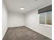 Finished basement area with neutral carpet, a window, and recessed lighting at 2025 Fenton St, Edgewater, CO 80214