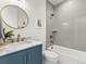 Charming bathroom with a tub and shower combination, elegant vanity, and stylish bronze fixtures at 2025 Fenton St, Edgewater, CO 80214