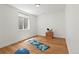 Versatile bonus room with hardwood floors, a window, and space for exercise equipment or a home office at 2025 Fenton St, Edgewater, CO 80214