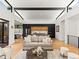 Open-concept living space with a modern kitchen, dining area, and comfortable seating, perfect for entertaining and everyday living at 2025 Fenton St, Edgewater, CO 80214