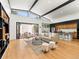 Bright and airy living space with soaring ceilings, hardwood floors, and a seamless connection to the outdoor patio and kitchen at 2025 Fenton St, Edgewater, CO 80214
