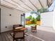 Inviting outdoor patio with comfortable seating, modern shade structure, and fenced yard at 2025 Fenton St, Edgewater, CO 80214