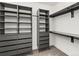 Organized walk-in closet with custom shelving and drawer systems at 2025 Fenton St, Edgewater, CO 80214