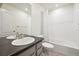 Hall bathroom featuring a shower-tub combination, gray cabinetry and fixtures, and neutral tile flooring at 3831 E 141St Ave, Thornton, CO 80602