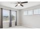 Bright bedroom with large windows, neutral walls, and modern ceiling fan for optimal comfort at 3831 E 141St Ave, Thornton, CO 80602