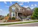 Inviting two story home with manicured landscaping, neutral colored exterior and a charming covered front porch at 3831 E 141St Ave, Thornton, CO 80602