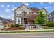 Charming two-story home featuring a well-maintained lawn, garden beds, and neutral-toned facade at 3831 E 141St Ave, Thornton, CO 80602