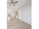Spacious living area featuring hardwood floors, recessed lighting, and an open floor plan at 3831 E 141St Ave, Thornton, CO 80602